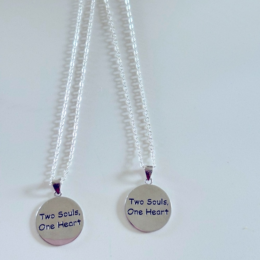 2 18’ silver necklaces with Best Friend charms that hold two souls, one heart..